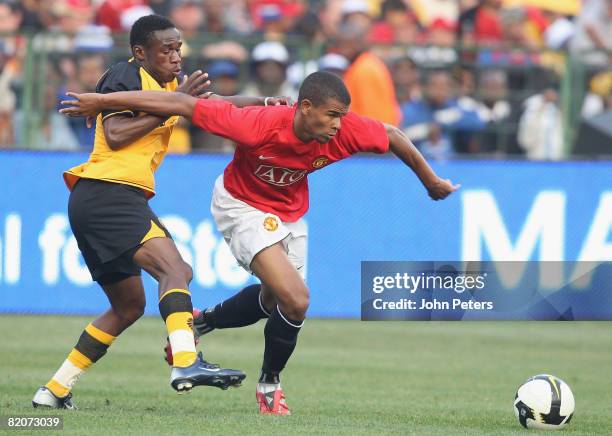 Fraizer Campbell of Manchester United clashes with Onismor Bhasera of Kaizer Chiefs during the Vodacom Challenge pre-season friendly match between...