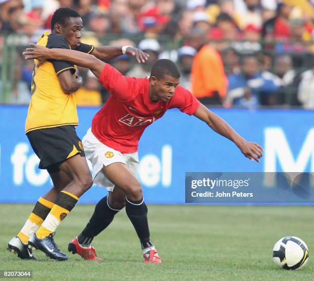 Fraizer Campbell of Manchester United clashes with Onismor Bhasera of Kaizer Chiefs during the Vodacom Challenge pre-season friendly match between...