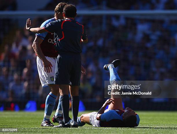 Wilfred Bouma of Aston Villa seriously injures his leg during the UEFA Intertoto Cup third round second leg match between Aston Villa and Odense BK,...