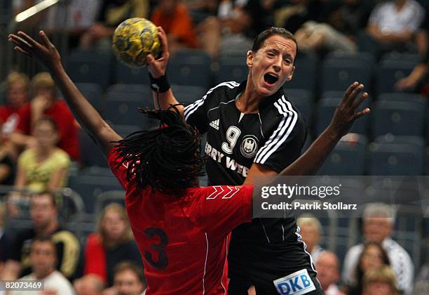 Jutta Steinbach of Germany battles against Ilda Bengue during the women's international friendly handball match between Germany and Angola at the...