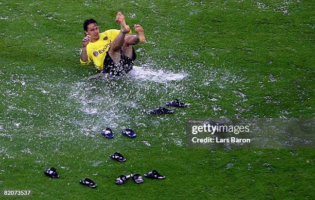 Neven Subotic of Dortmund slides on the pitch after the pre season friendly match between Borussia Dortmund and Juventus Turin at the Signal Iduna...