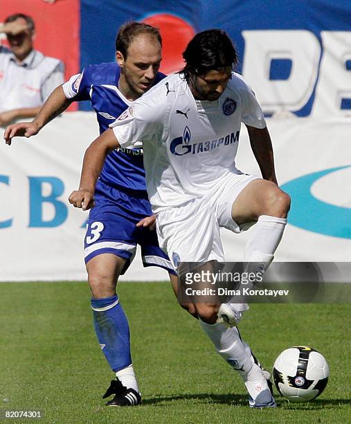 Jovan Tanasijevic of FC Dynamo Moscow competes for the ball with Alejandro Dominguez of FC Zenit Saint Petersburg during the Russian Football League...