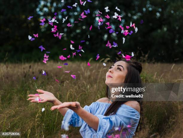 raining butterfly confetti - catching butterflies stock pictures, royalty-free photos & images