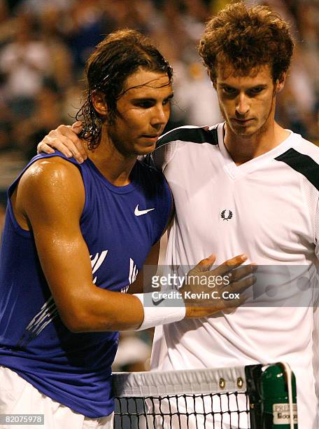 Rafael Nadal of Spain hugs Andy Murray of Great Britain after defeating him during the Rogers Cup at the Rexall Centre at York University on July 26,...