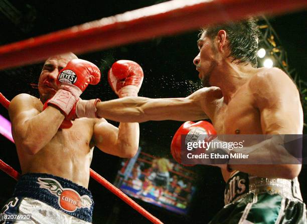 Antonio Margarito hits Miguel Cotto during their WBA welterweight title fight at the MGM Grand Garden Arena July 26, 2008 in Las Vegas, Nevada....