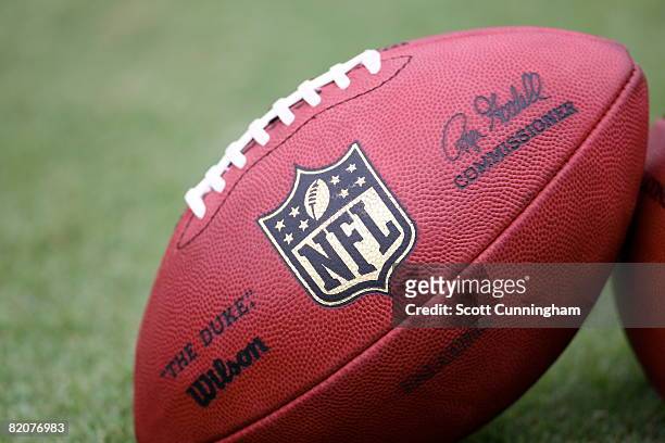 An official football is shown with the new NFL logo during training camp at the Atlanta Flacons Training Facility on July 26, 2008 in Flowery Branch,...