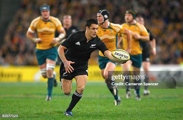 Dan Carter of the All Blacks chases the ball during the 2008 Tri Nations series Bledisloe Cup match between the Australian Wallabies and the New...