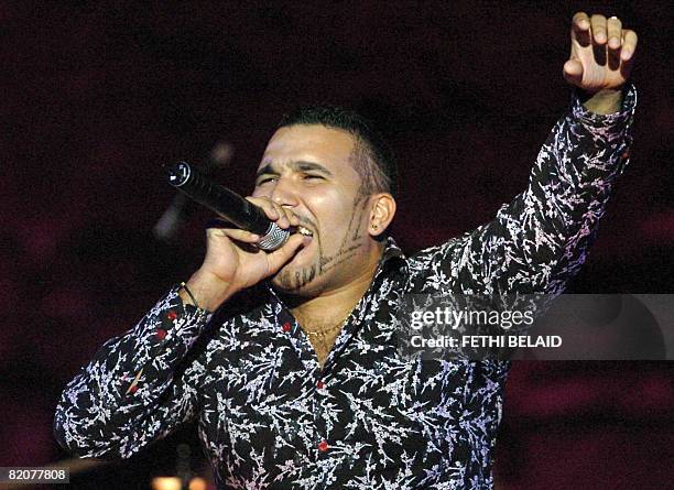 Algerian Rai singer Chab Ridha Talyani performs during the 44th International Carthage festival on 26 July 2008 at the Roman theatre in Carthage,...