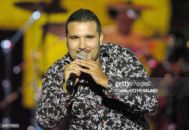 Algerian Rai singer Chab Ridha Talyani performs during the 44th International Carthage festival on 26 July 2008 at the Roman theatre in Carthage,...