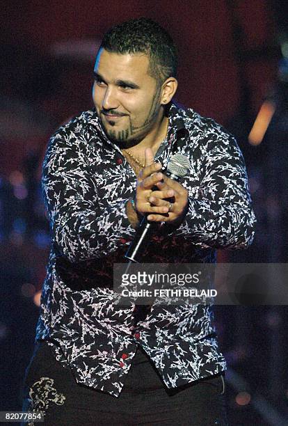 Algerian Rai singer Chab Ridha Talyani performs during the 44th International Carthage festival on 26 July 2008 at the Roman theatre in Carthage,...