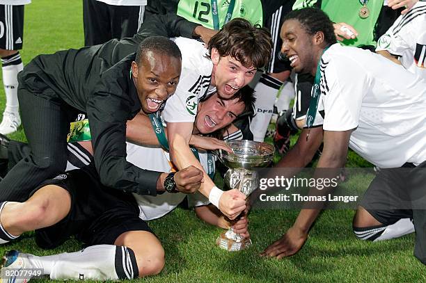 Savio Nsereko, Danny Latza, Deniz Naki and Richard Sukuta-Pasu of Germany celebrate after the U19 European Championship final match between Germany...