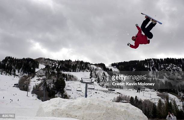 Snowboarder known as "The New Zealand Legend" flies over the heights of Aspen Mountain ski area in Colorado, April1 the first day snowboarders will...