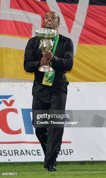 Savio Nsereko of Germany is seen with the cup after the U19 European Championship final match between Germany and Italy at the Strelnice stadium on...