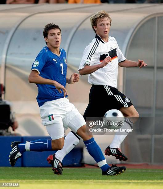 Republic Bjoern Kopplin of Germany and Alberto Paloschi of Italy during the U19 European Championship final match between Germany and Italy at the...