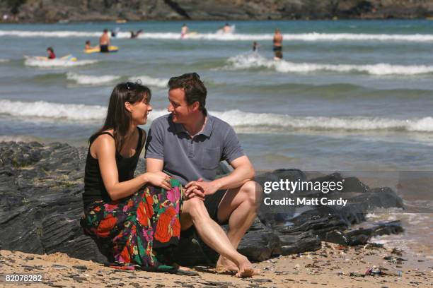 David Cameron and his wife Samantha sit on the beach at Harlyn Bay on July 27, 2008 in Harlyn, near Padstow, England. David Cameron, leader of the...