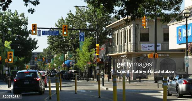 businesses on main street, penticton, british columbia, canada, in summer - penticton stock pictures, royalty-free photos & images