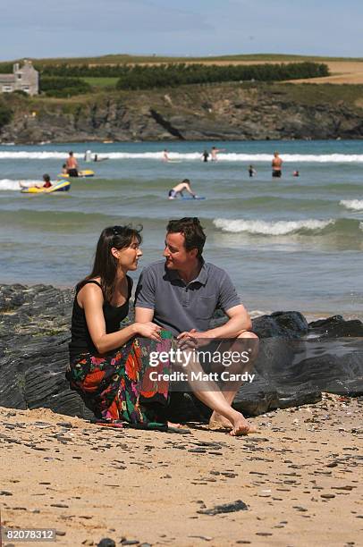 David Cameron and his wife Samantha sit on the beach at Harlyn Bay on July 27, 2008 in Harlyn, near Padstow, England. David Cameron, leader of the...