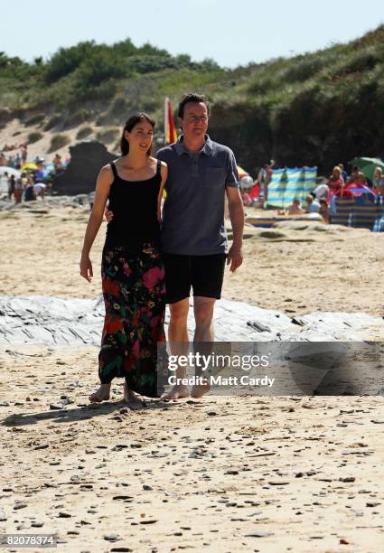 David Cameron and his wife Samantha walk on the beach at Harlyn Bay on July 27, 2008 in Harlyn, near Padstow, England. David Cameron, leader of the...