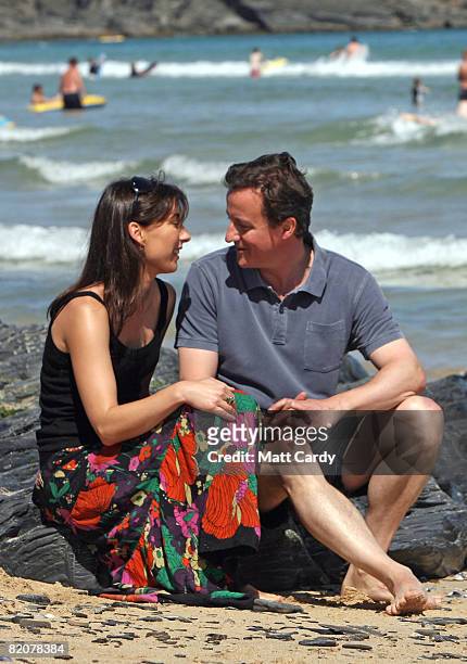 David Cameron and his wife Samantha sit on the beach at Harlyn Bay on July 27, 2008 in Harlyn, near Padstow, England. David Cameron, leader of the...