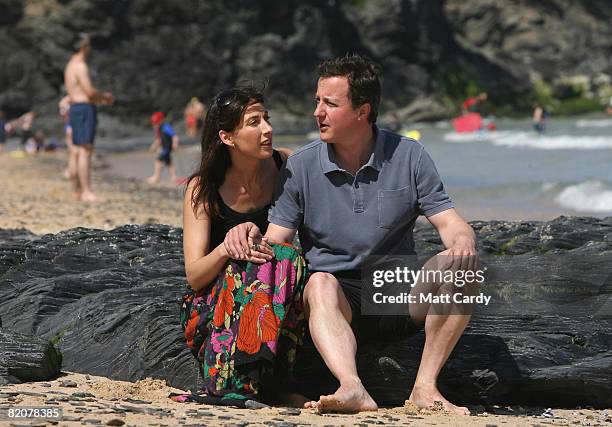 David Cameron and his wife Samantha sit on the beach at Harlyn Bay on July 27, 2008 in Harlyn, near Padstow, England. David Cameron, leader of the...