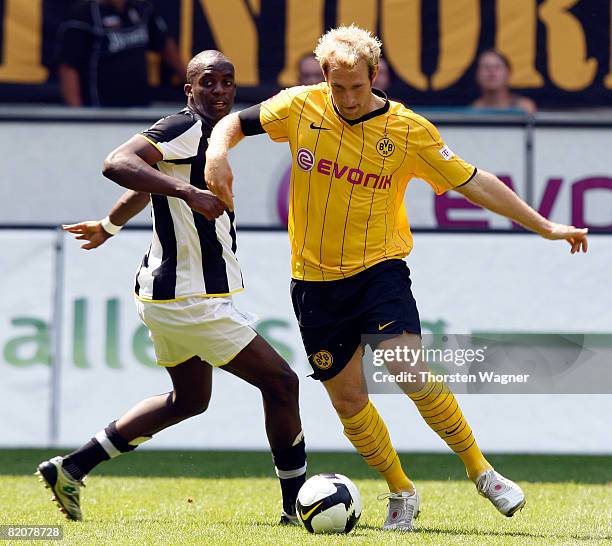 Florian Kringe of Borussia Dortmund battles for the ball with Lamine Mohamed Sissoko of Juventus Turin during the Pre Season international friendly...