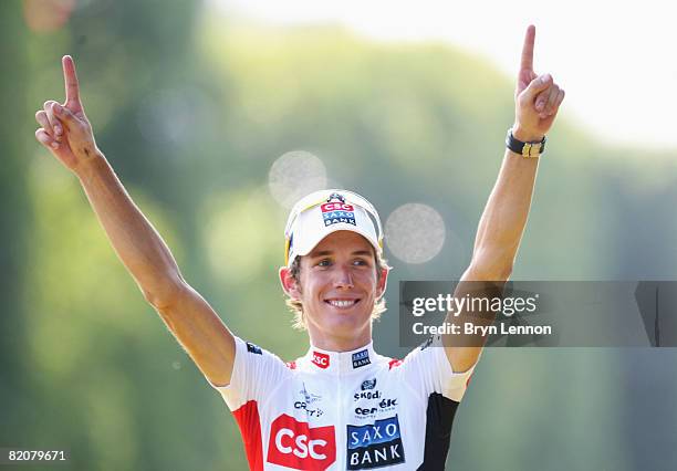 White Jersey for Best Young Rider winner Andy Schleck of Luxembourg and Team CSC Saxo Bank celebrates on the podium during Stage Twenty One of the...