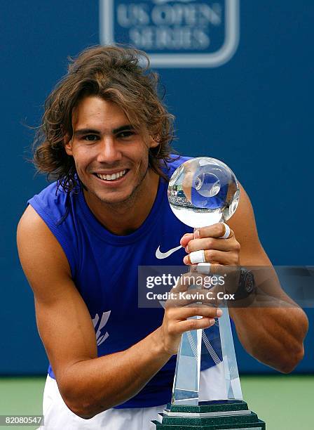 Rafael Nadal of Spain poses with the Rogers Cup trophy after defeating Nicolas Kiefer of Germany during the Rogers Cup at the Rexall Centre at York...