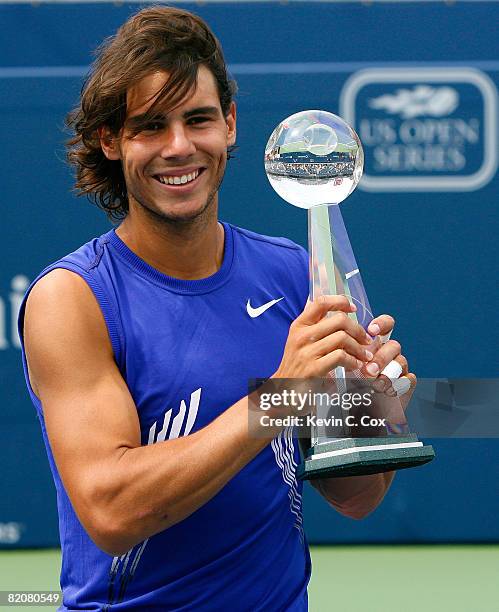 Rafael Nadal of Spain poses with the Rogers Cup trophy after defeating Nicolas Kiefer of Germany during the Rogers Cup at the Rexall Centre at York...