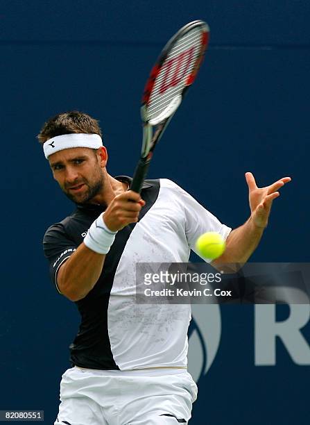 Nicolas Kiefer of Germany returns a shot to Rafael Nadal of Spain during the Rogers Cup at the Rexall Centre at York University July 27, 2008 in...