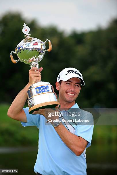 Chez Reavie lifts the winner's trophy after winning the RBC Canadian Open at the Glen Abbey Golf Club on July 27, 2008 in Oakville, Ontario, Canada.