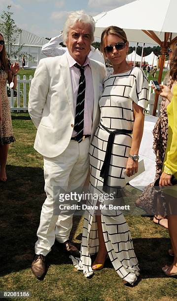 Nicky Haslam and a guest attend the annual Cartier International Polo Day, at the Cartier Marquee in Great Windsor Park on July 27, 2008 in Windsor,...