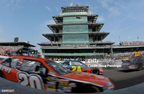 Tony Stewart, driver of the Home Depot Toyota, and Jeff Burton, driver of the DuPont Chevrolet, follow Jamie McMurray, in the Crown Royal Ford, pass...