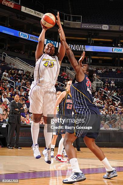 Le'coe Willingham of the Phoenix Mercury shoots against Ebony Hoffman of the Indiana Fever on July 27 at U.S. Airways Center in Phoenix, Arizona....