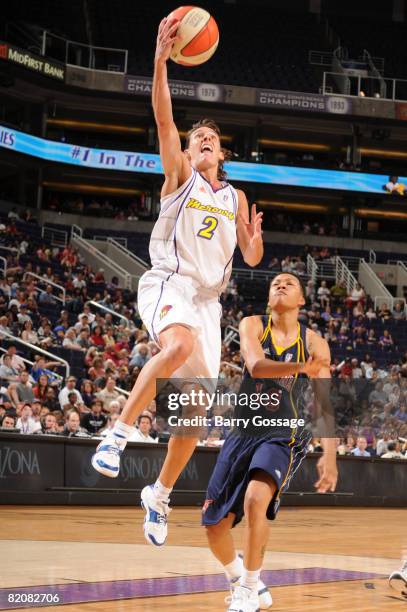 Kelly Miller of the Phoenix Mercury shoots against LaToya Bond of the Indiana Fever on July 27 at U.S. Airways Center in Phoenix, Arizona. NOTE TO...