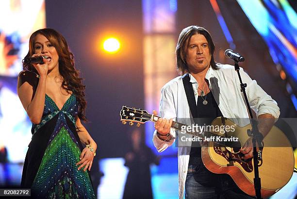 Miley Cyrus and Billy Ray Cyrus perform on stage during the 2008 CMT Music Awards at the Curb Events Center at Belmont University on April 14, 2008...