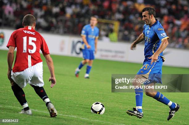 Portsmouth's Glen Little tries to beat Manchester United's Vidic Nemanja during the friendly football match between the two English premiership teams...