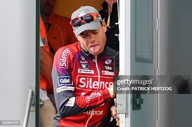 Second placed in the overall standings, Australian team leader Cadel Evans , makes a face as he leaves the anti-doping control bus after undergoing...