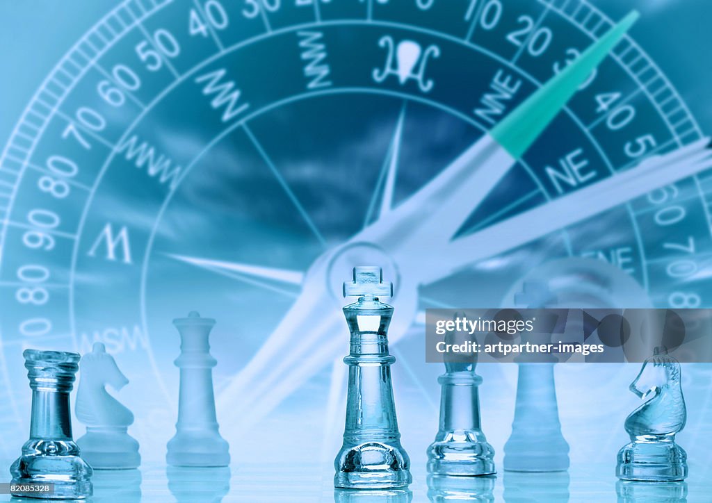 Chess Pieces With A Compass In The Background High-Res Vector