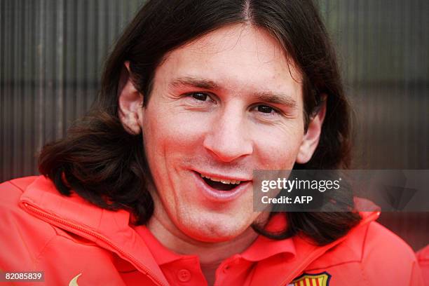 Barcelona's Lionel Messi is pictured on the bench during a friendly football match against Dundee United at Tannadice Stadium in Dundee, Scotland, on...