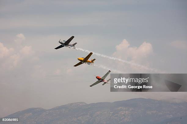 Aerial acrobatic planes fly overhead in formation during Canada Day festivities in this 2008 Penticton, British Columbia, Canada, summer photo....