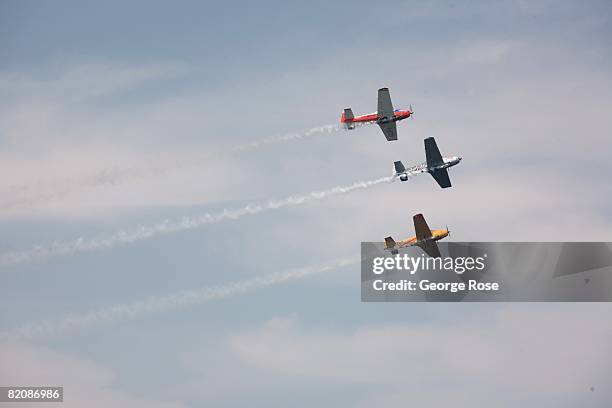 Aerial acrobatic planes fly overhead in formation during Canada Day festivities in this 2008 Penticton, British Columbia, Canada, summer photo....