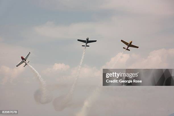 Aerial acrobatic planes fly overhead in formation during Canada Day festivities in this 2008 Penticton, British Columbia, Canada, summer photo....