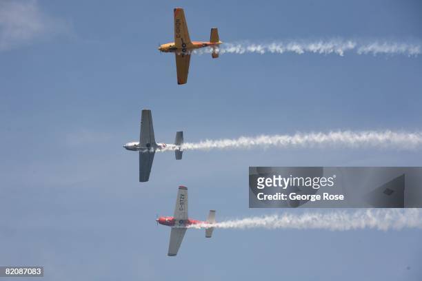 Aerial acrobatic planes fly overhead during Canada Day festivities in this 2008 Penticton, British Columbia, Canada, summer photo. Canada Day is the...