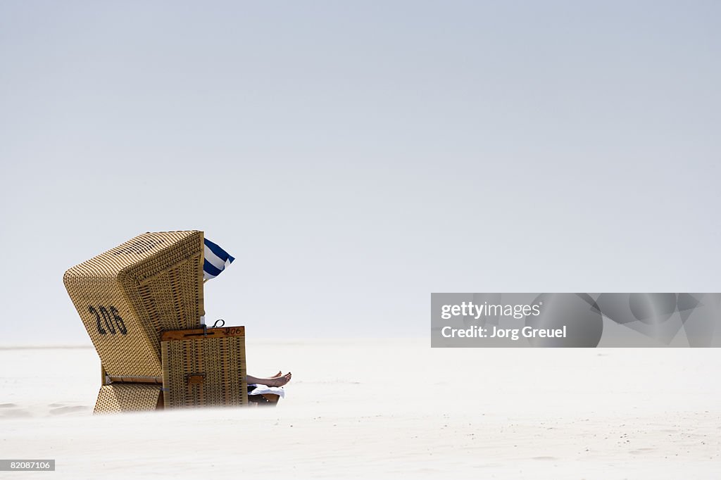 Wicker chair on beach