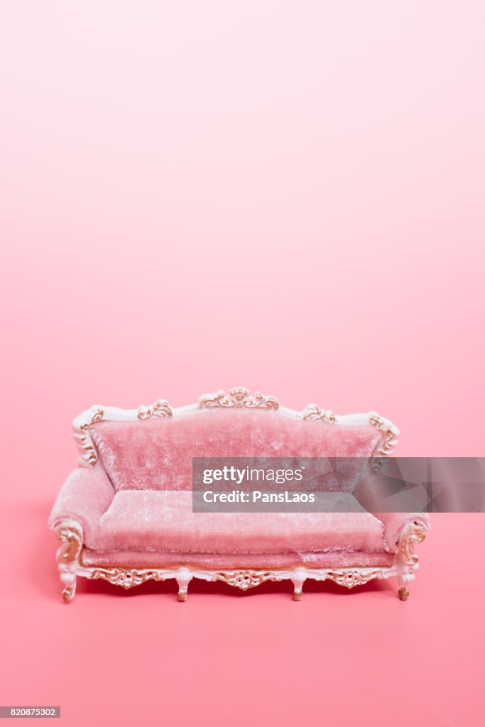 Sofa on pink background