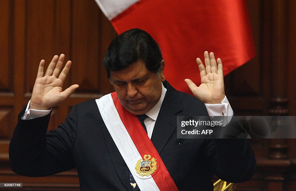 Peruvian President Alan Garcia gestures