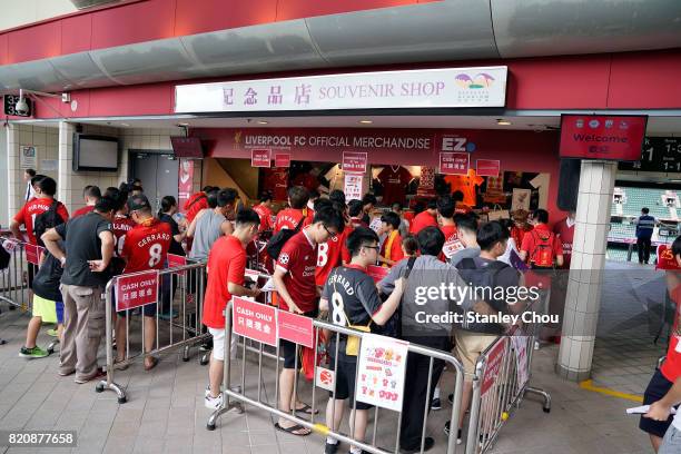 Liverpool fans buy souvenirs at the official merchandise Liverpool booth during the Premier League Asia Trophy match between Liverpool FC and...