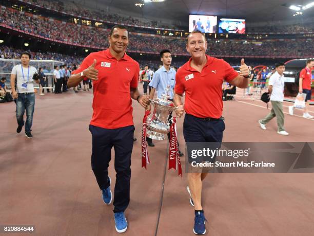 Arsenal legends Gilberto and Ray Parlour parade the FA Cup before the pre season friendly between Arsenal and Chelsea at the Birds Nest on July 22,...