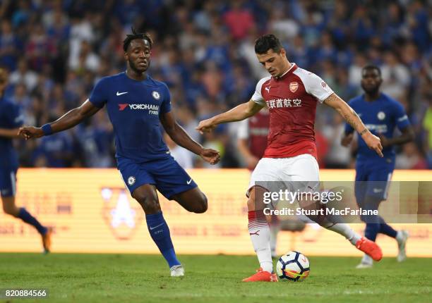 Grsnit Xhaka of Arsenal takes on Michy Batshuayi of Chelsea during the pre season friendly between Arsenal and Chelsea at the Birds Nest on July 22,...