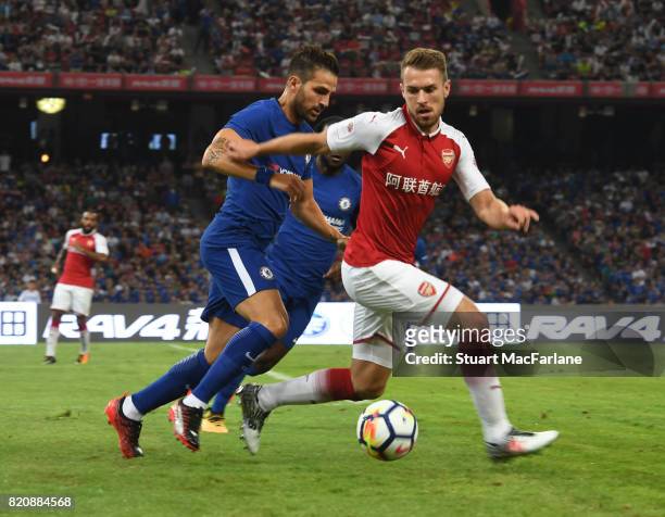 Aaron Ramsey of Arsenal takes Cesc Fabregas during the pre season friendly between Arsenal and Chelsea at the Birds Nest on July 22, 2017 in Beijing,...